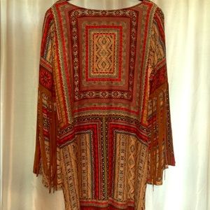 Dress with leather fringed sleeves